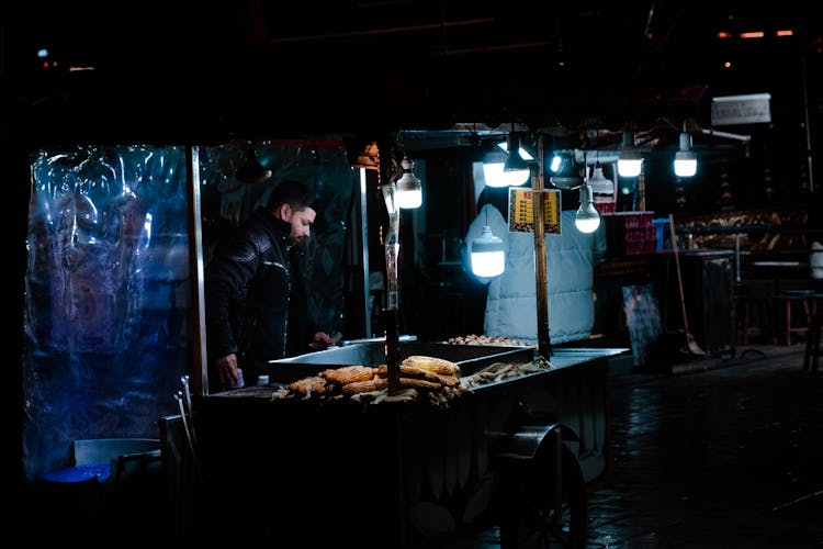 Man Cooking Food On A Street 