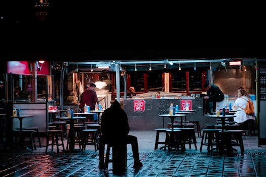 Captivating night shot of street food scene with people in city ambience.