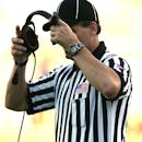 Man in Black Fitted Cap Holding Black Corded Headset