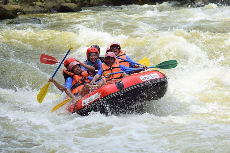 Group Of People Whitewater Rafting