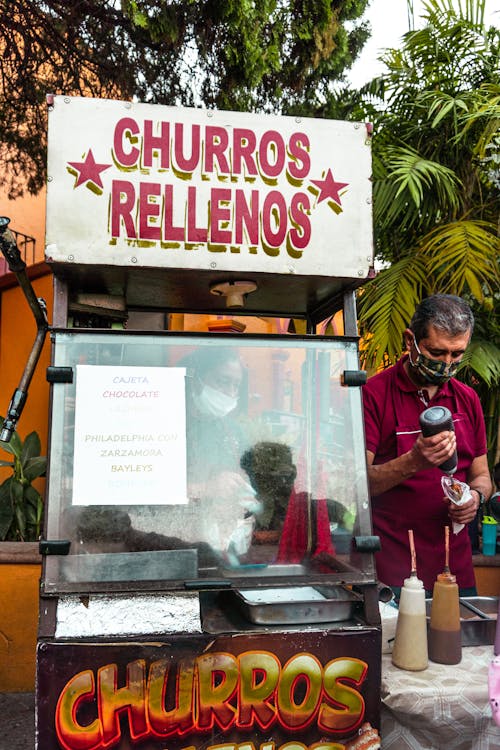 Fotos de stock gratuitas de churros, comida callejera, comida en pie