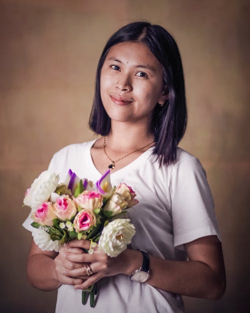 Free Photo of Woman Holding Bouquet Stock Photo