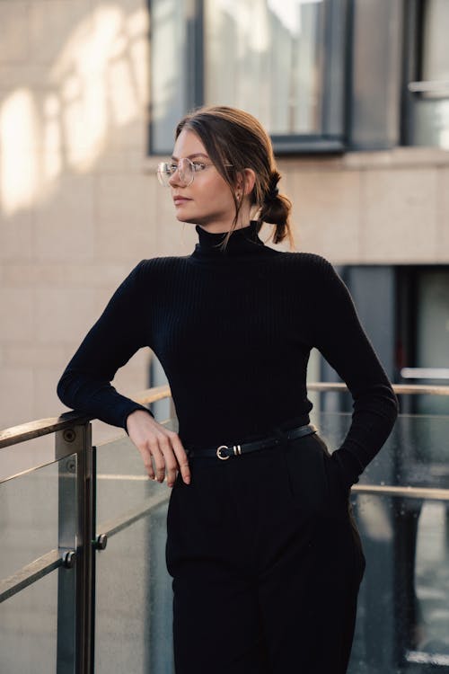 Photo of an Elegant Young Woman Wearing a Black Turtleneck
