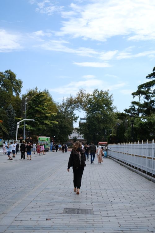 Free People walking on a paved street in İstanbul under a partly cloudy sky. Stock Photo