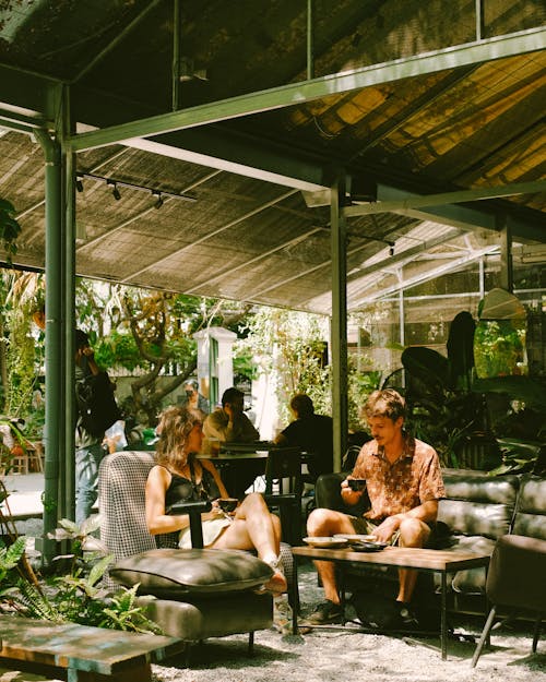 Couple Sitting at Tropical Cafe