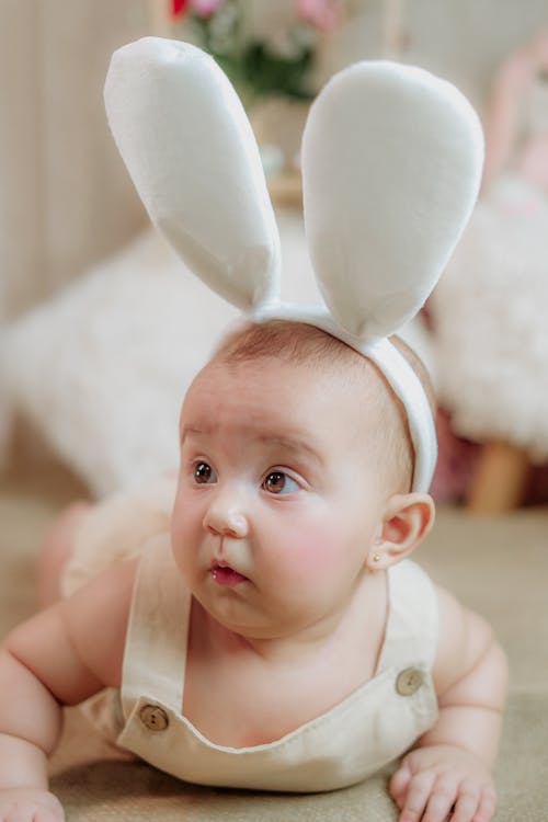 A Baby Wearing Bunny Ears for an Easter Photoshoot 