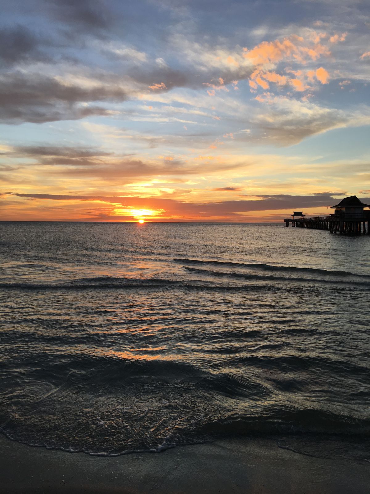 Sunrise over a Florida beach pier