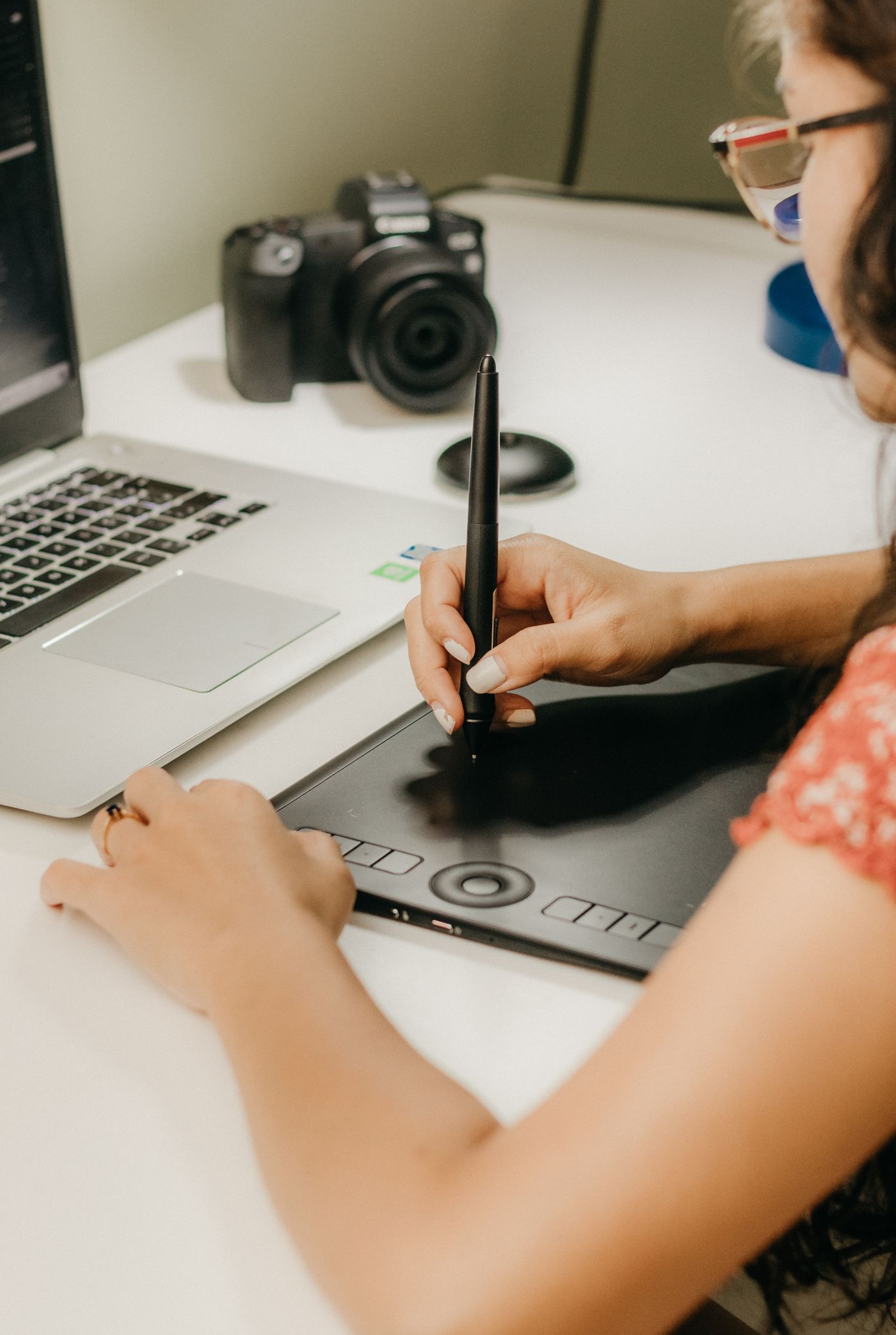 Product designer reviewing kinetic UI micro-interaction vector curves on screen