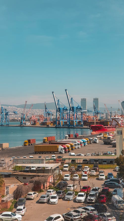 Semi-trucks and Cargo Ship in Transhipment Port