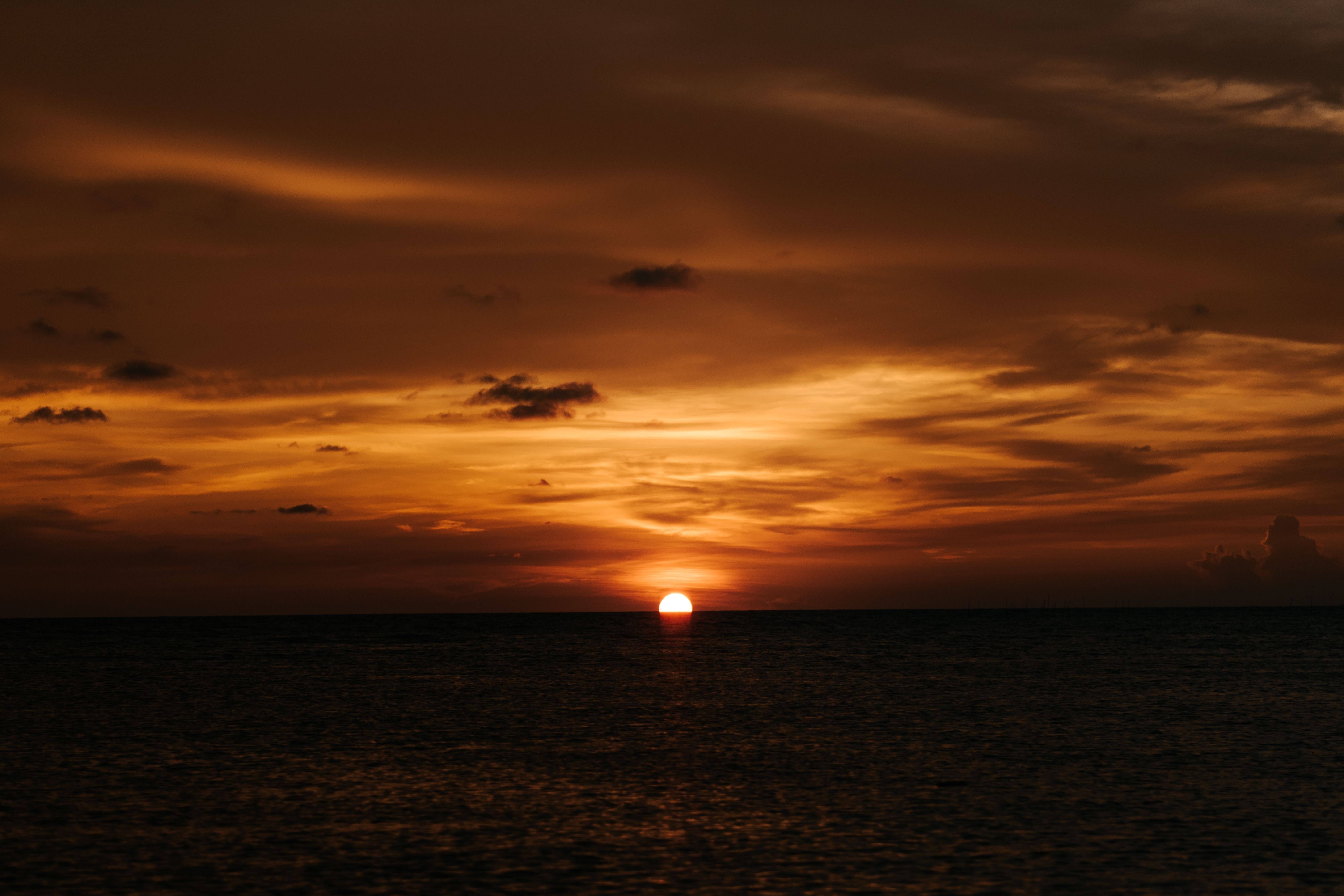 Yellow Sky over Sea at Sunset · Free Stock Photo