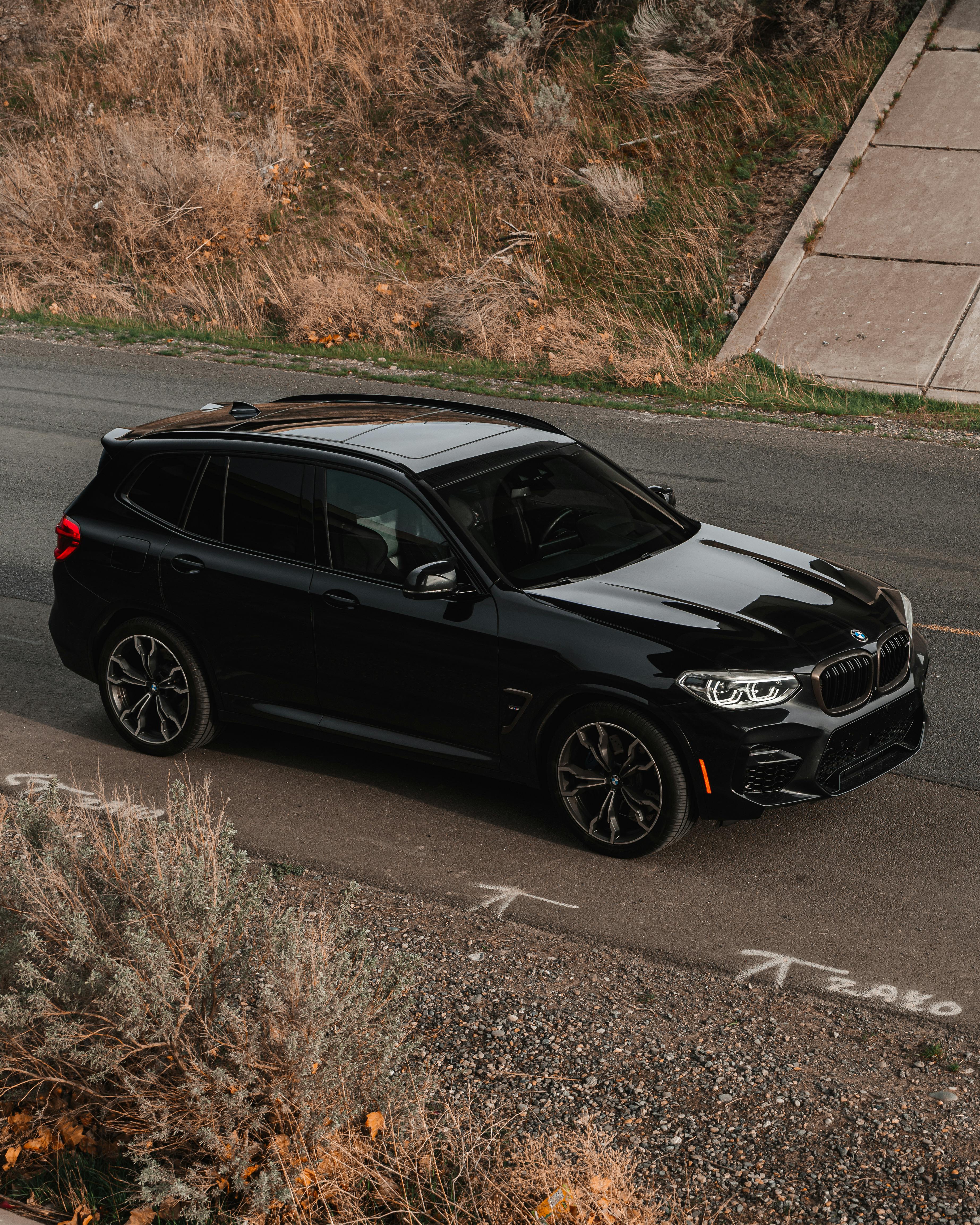 High Angle Shot of a Black BMW X3 on a Street · Free Stock Photo