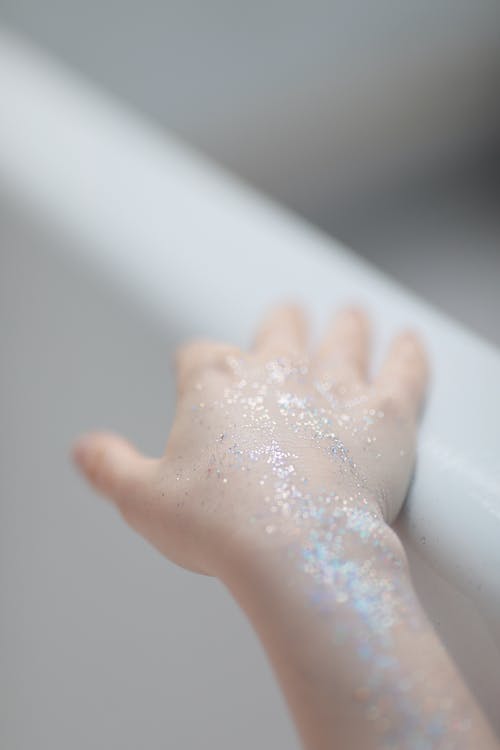 Close-up of Glitters on Hand