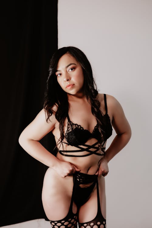 Young Woman Posing in Black Lingerie 
