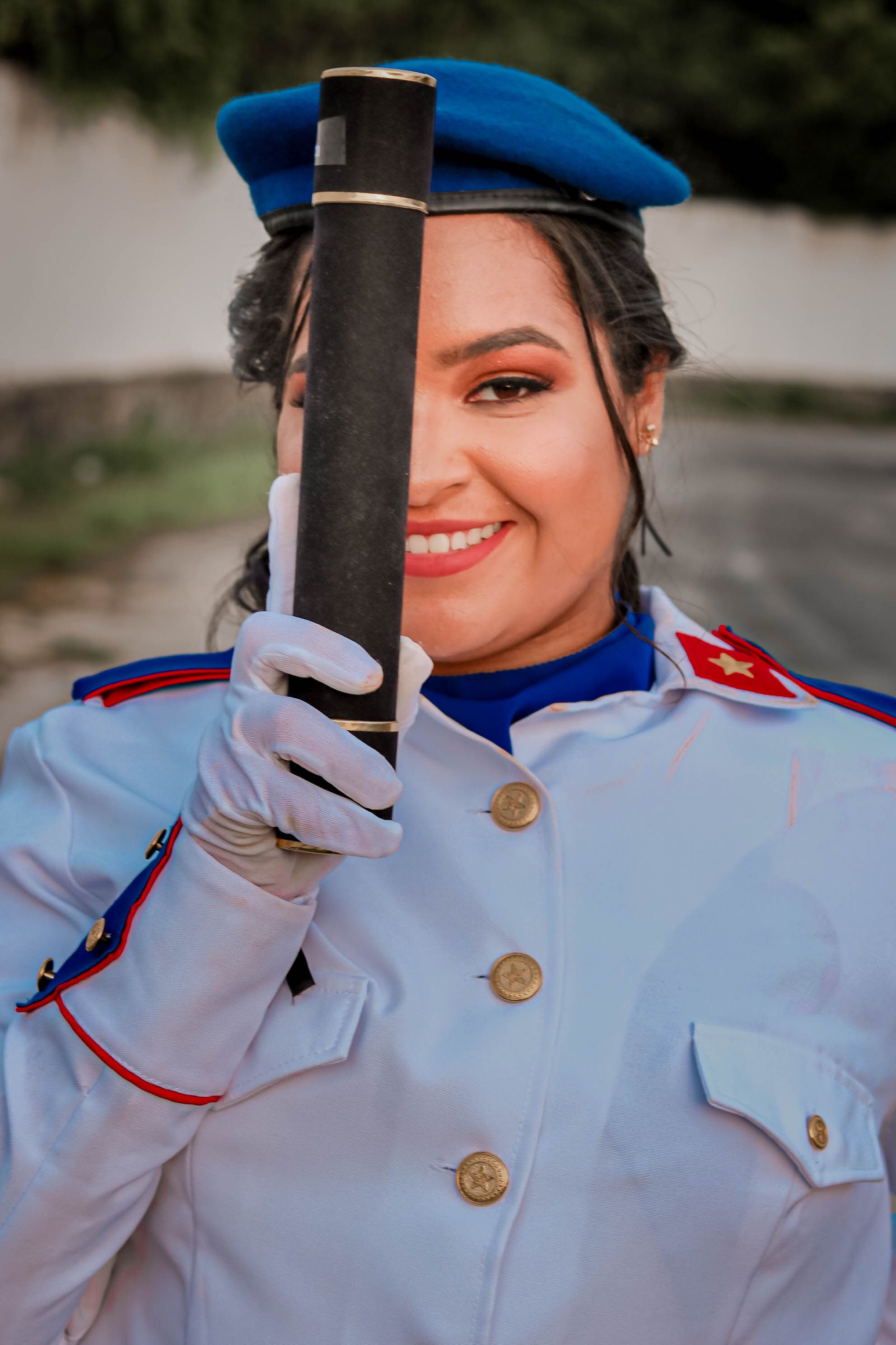 Woman in Uniform Holding a Musical Instrument · Free Stock Photo