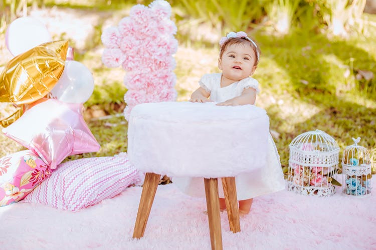 Child During Birthday Party In Garden