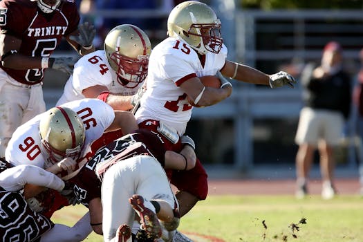 American football players in an intense match showcasing teamwork and determination on the field.
