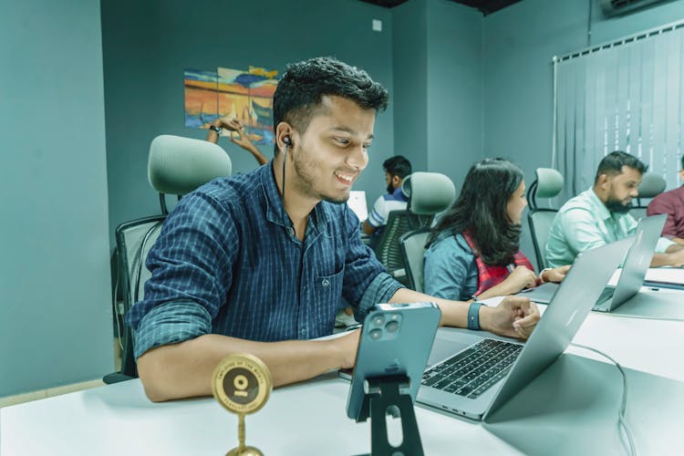 Smiling Man Working In Office