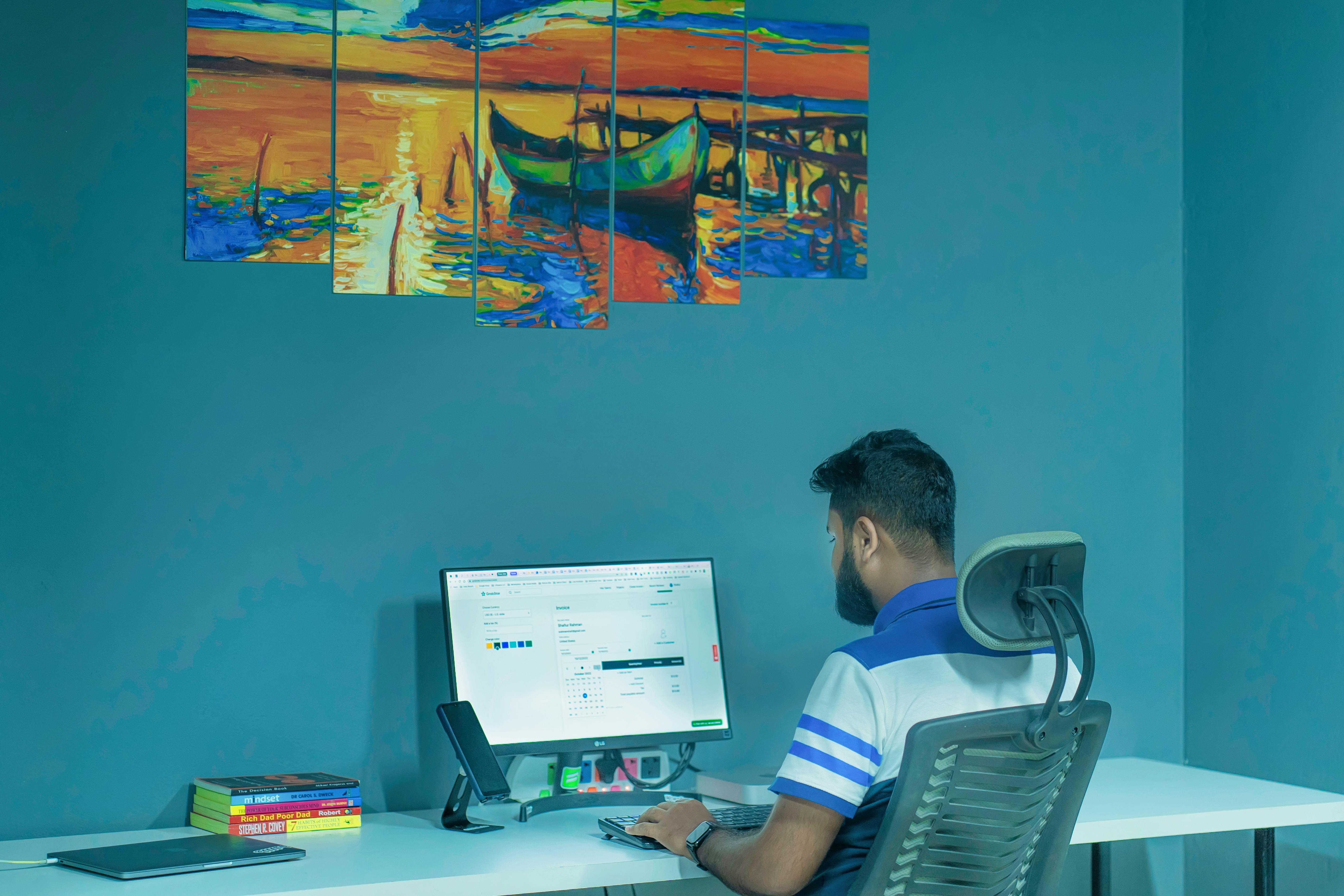 Man In Glasses Working On PC At Table Free Stock Photo man-in-glasses-working-on-pc-at-table-free-stock-photo
