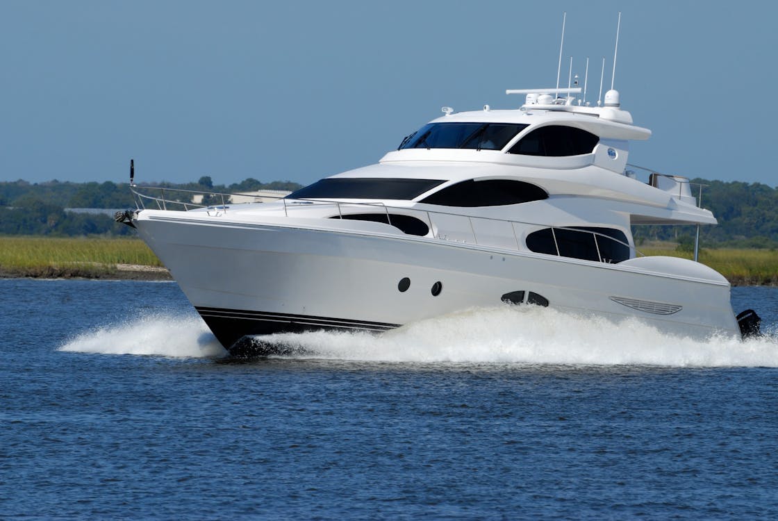 White Yacht On Running On Blue Body Of Water Overdag