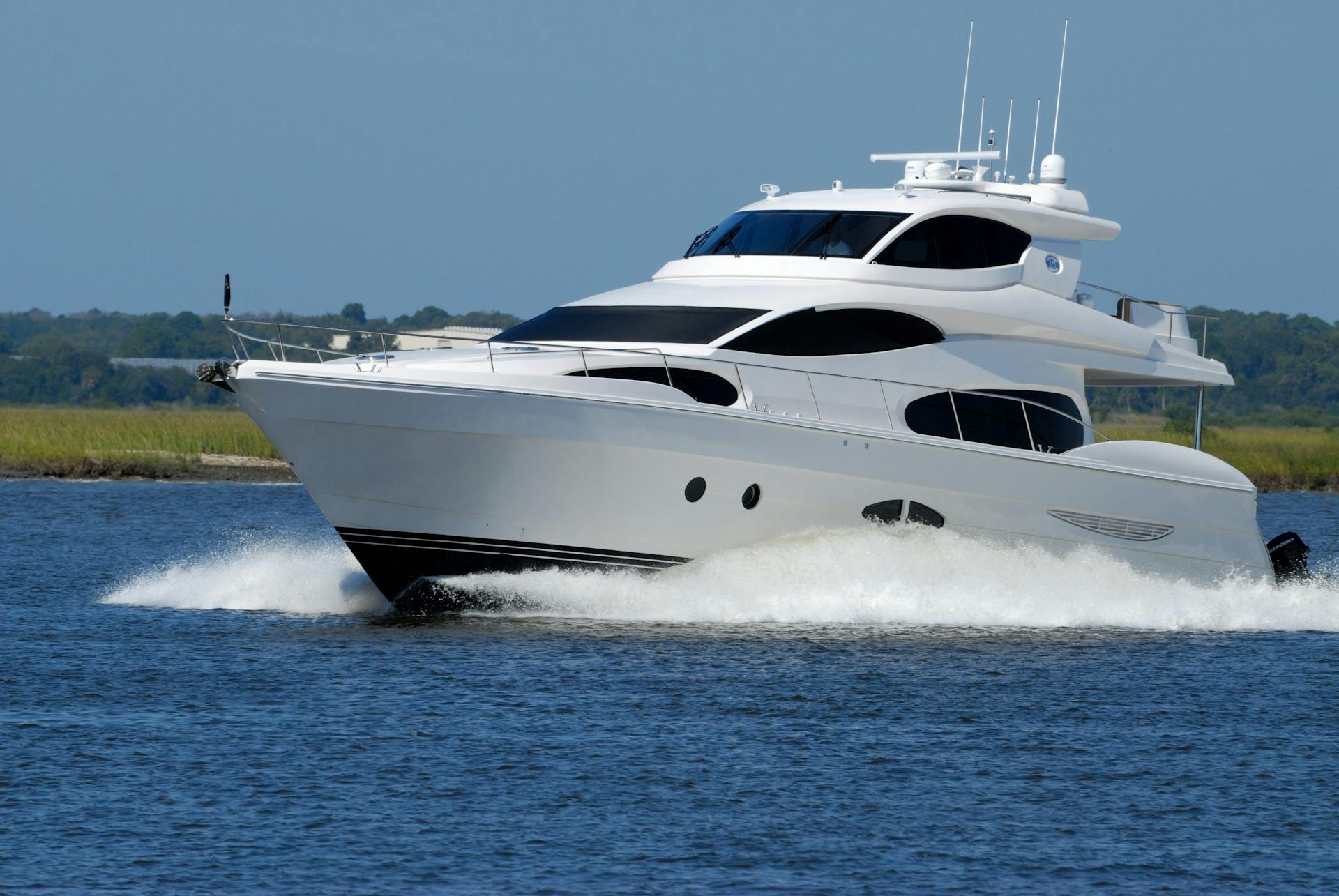 White Yacht on Running on Blue Body of Water during Daytime