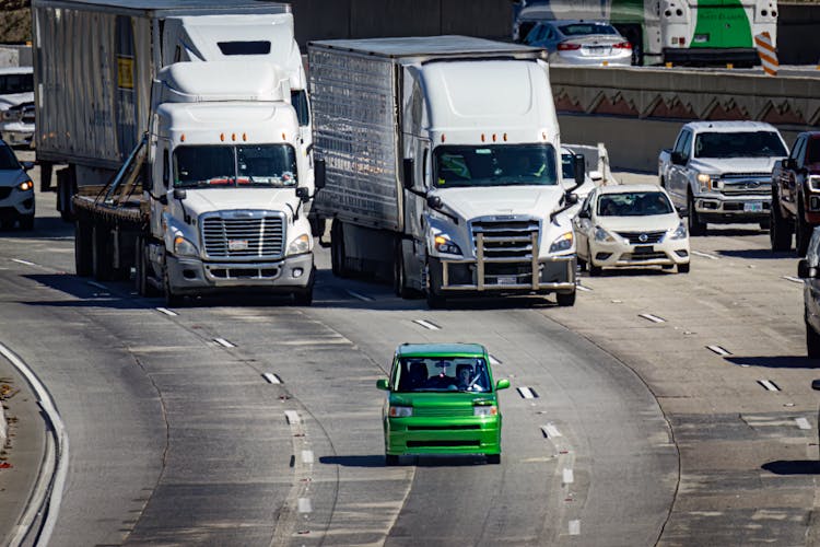 Trucks And Cars On A Busy Highway