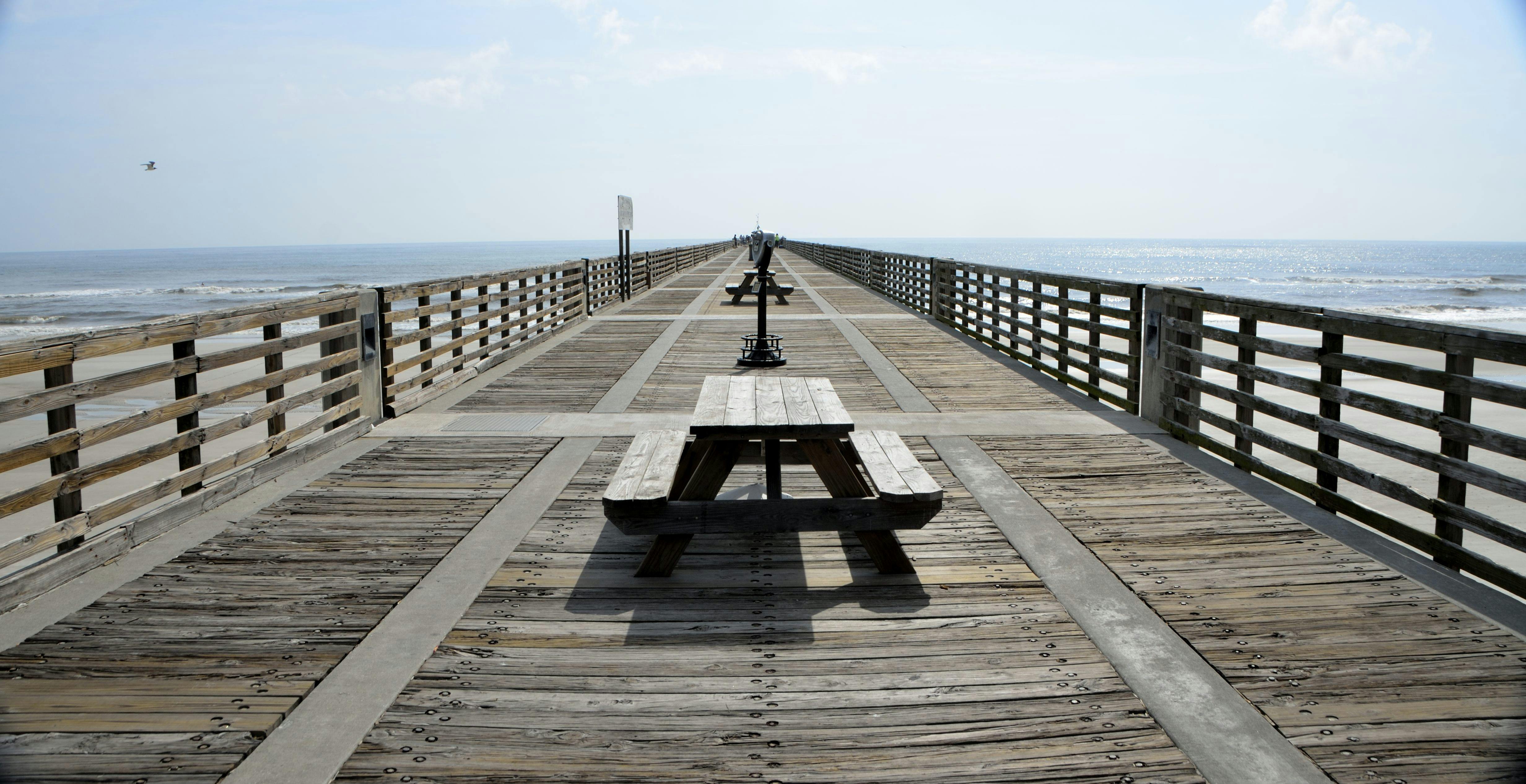 Black Wooden Picnic Table on the Wooden Dock · Free Stock Photo