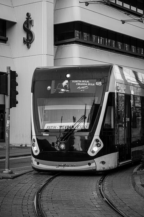 Black and White Picture of a Modern Tram in City 