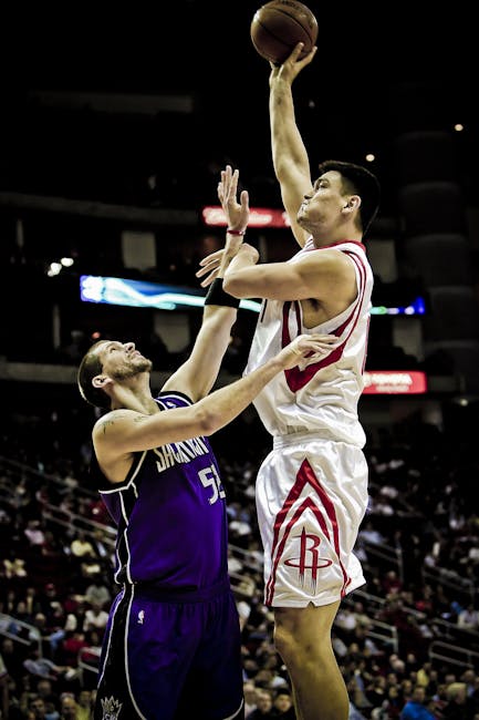 Yao Ming Holding Basketball on His Left Hand While Jumping