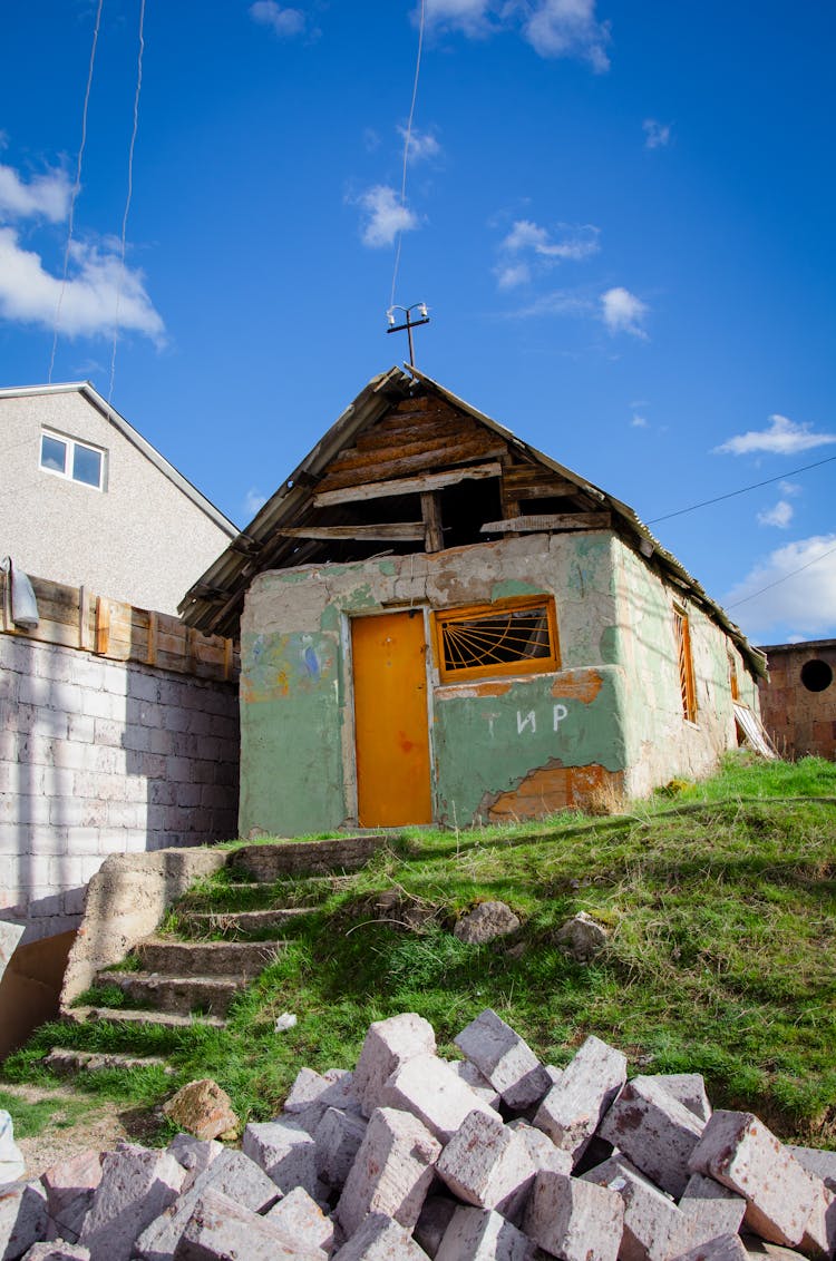 An Old Degraded House In A Town 