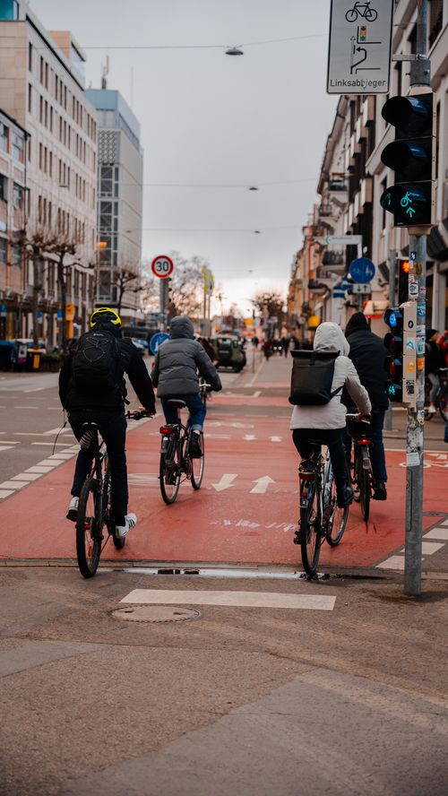 Free A group of cyclists navigating through an urban street in Heidelberg, Germany. Stock Photo
