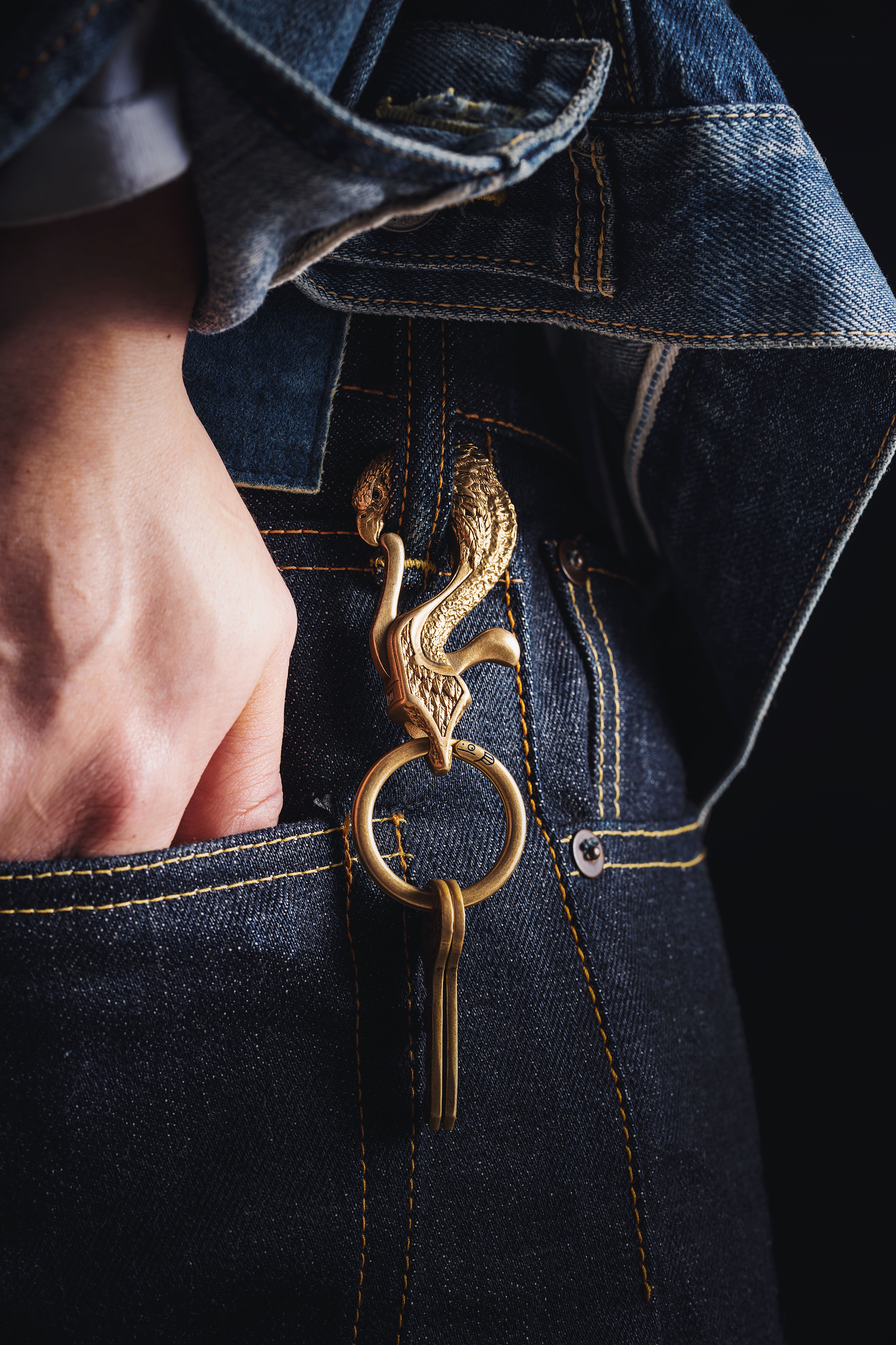 A keychain clipped to a belt loop for secure, reachable everyday carry