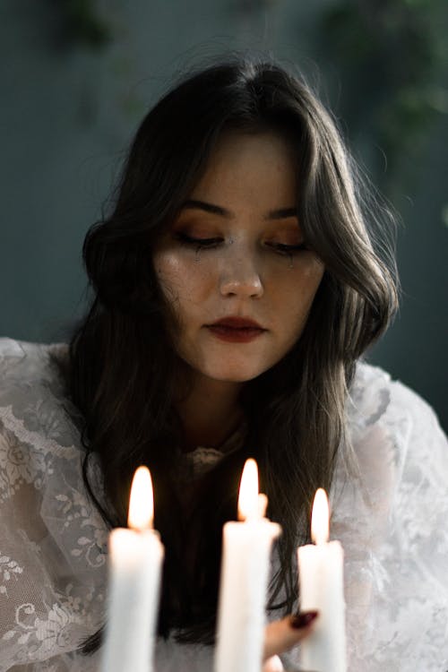 Face of Bride near Wax Candles