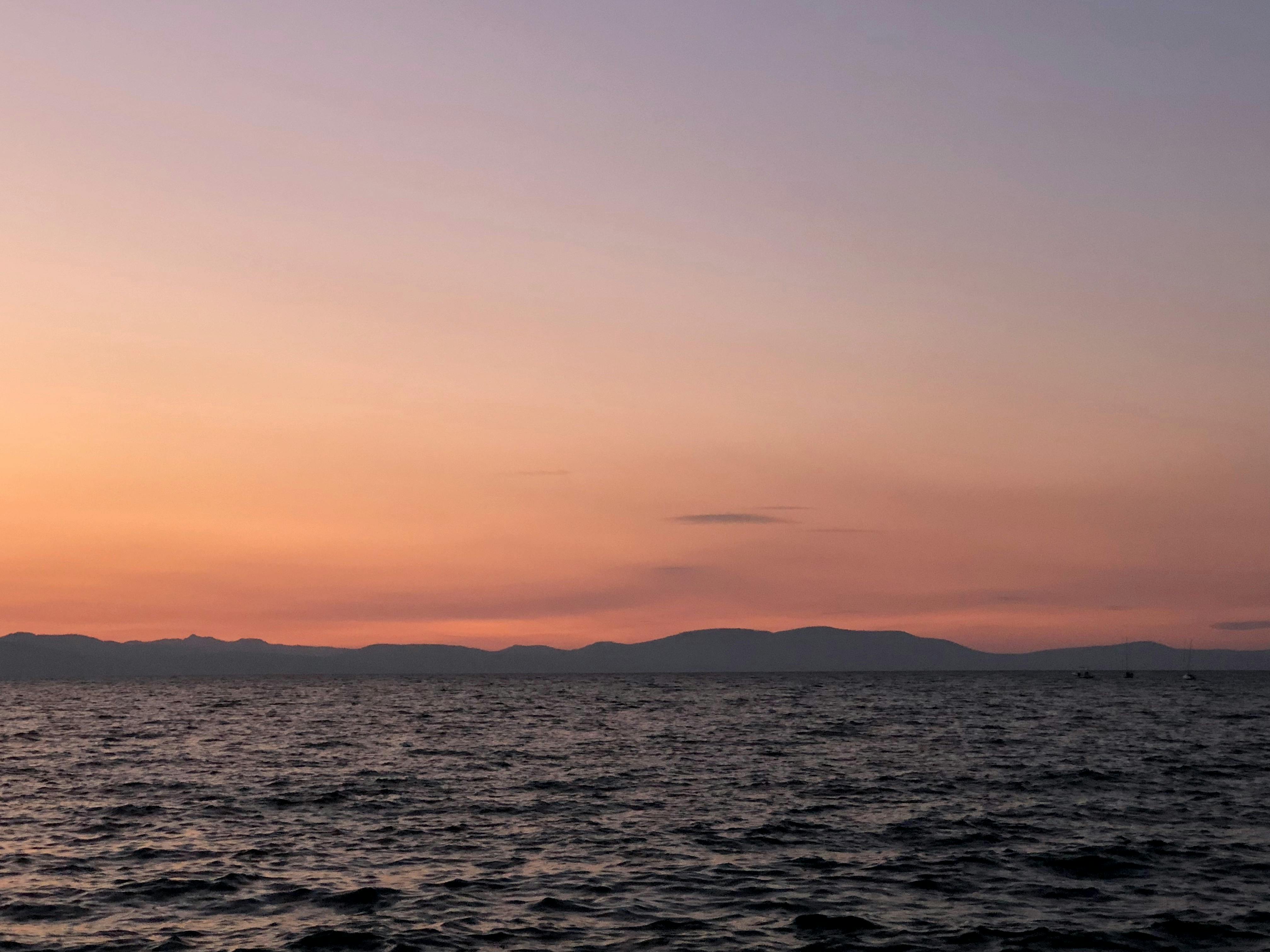 Close-up of hands holding a bowl of nuts