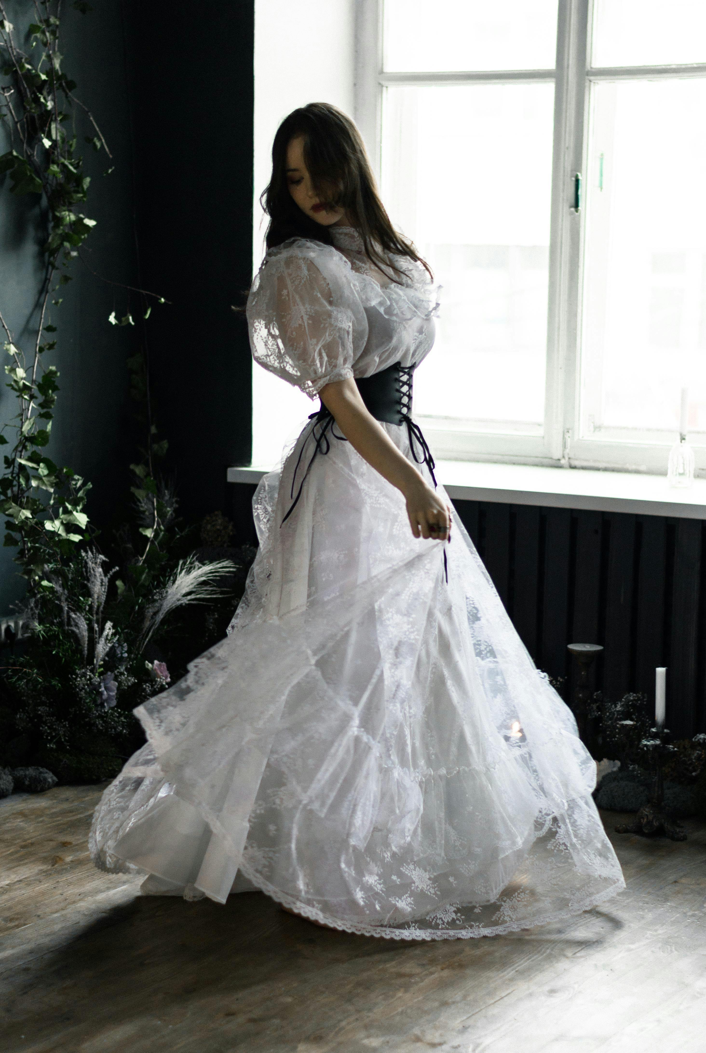 bride posing near windows