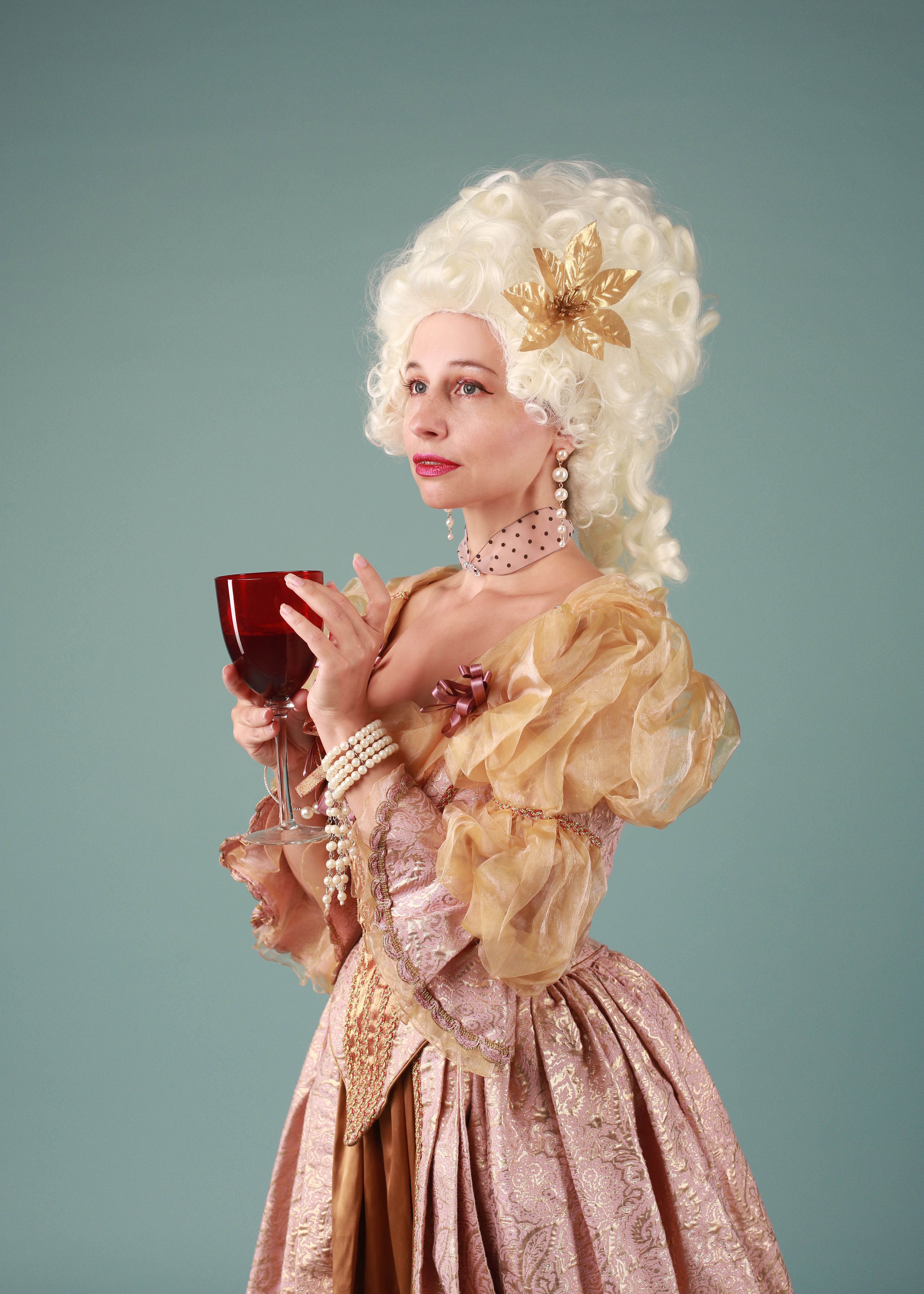 Portrait of a woman in historical attire holding a wine glass, exuding elegance and charm.