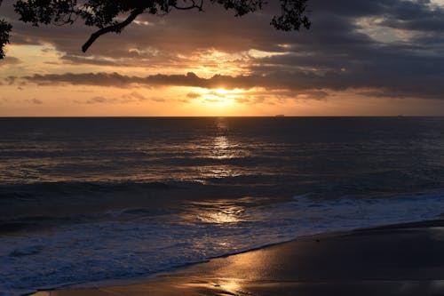 Seascape at Dusk with Sun Reflecting in Water