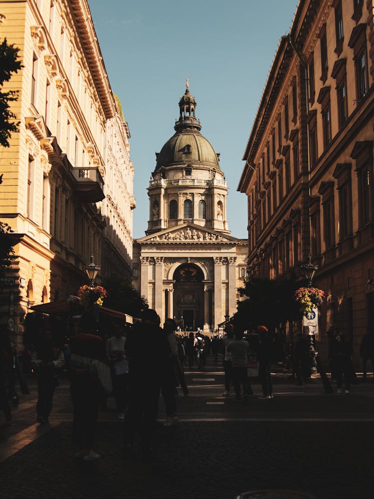 Pedestrians Against St. Stephen Basilica In Budapest