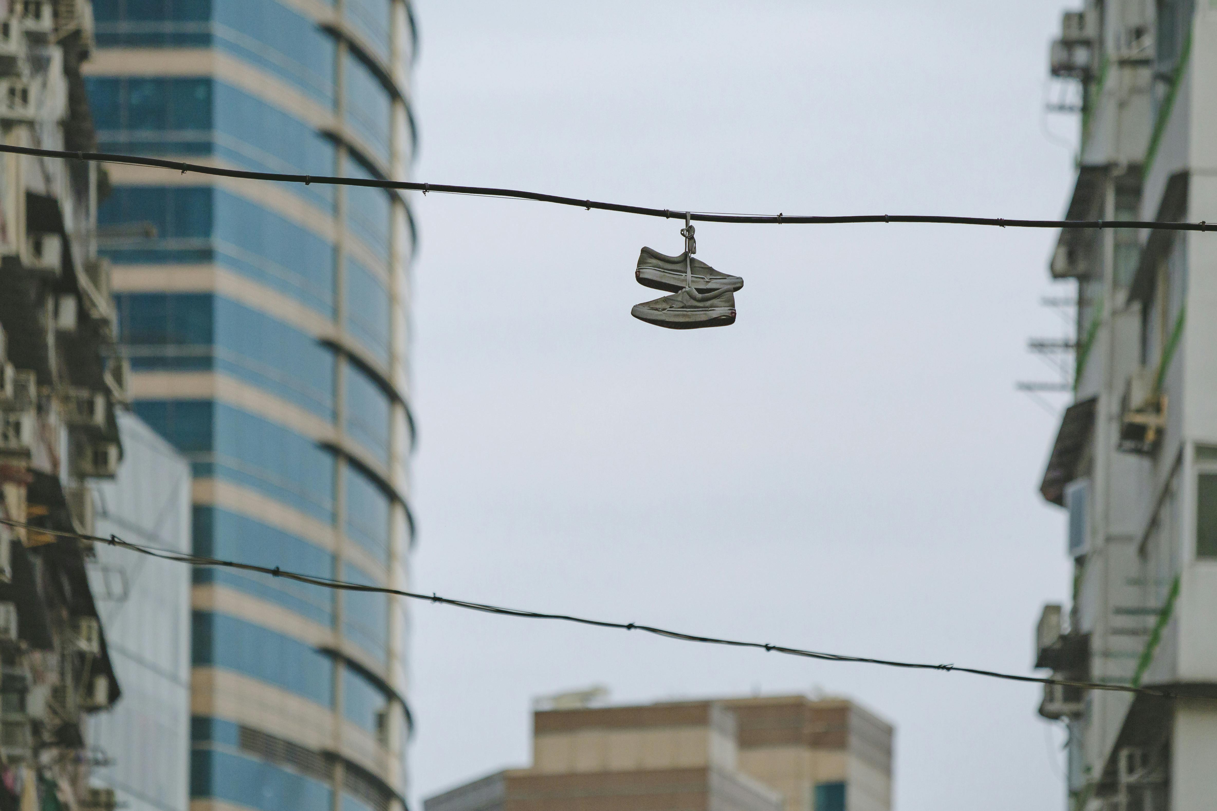 Pair of Shoe on Street Electric Cable \u00b7 Free Stock Photo