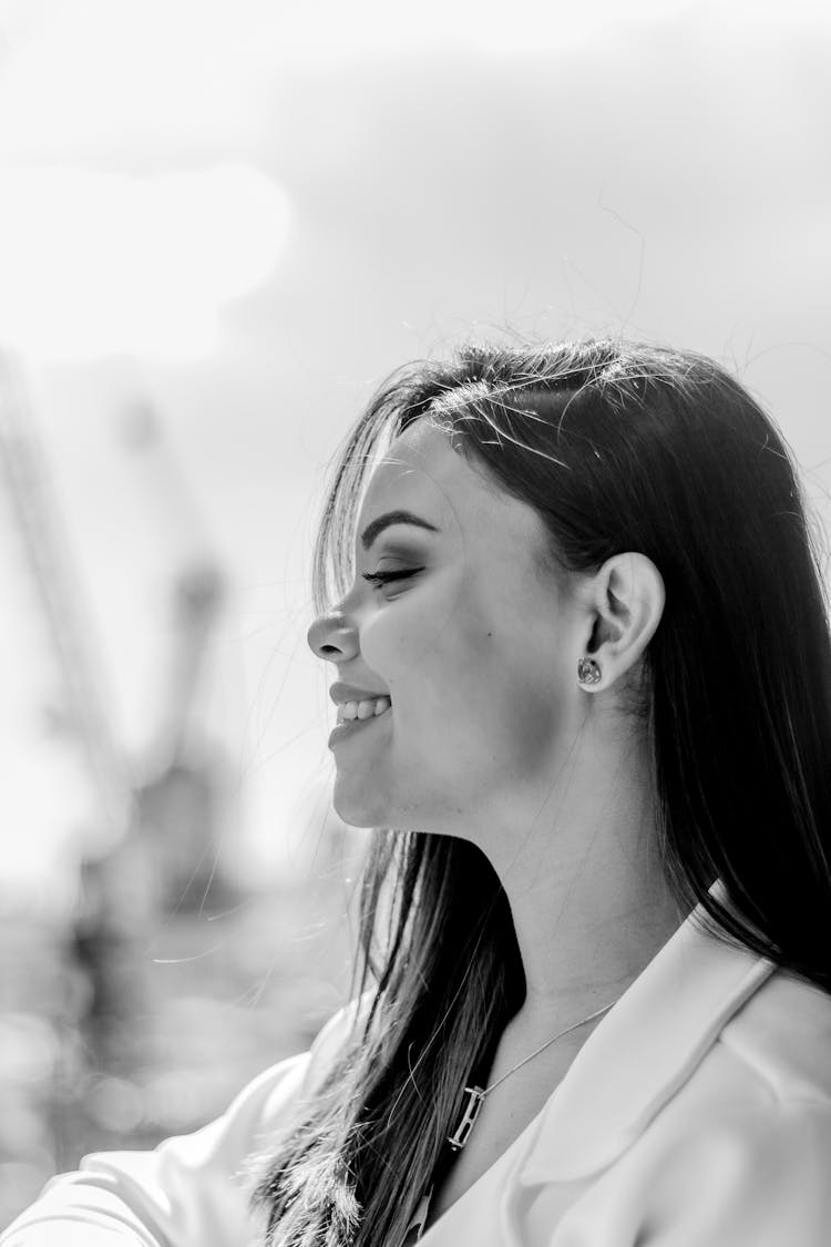 Black And White Profile Photo Of A Smiling Woman