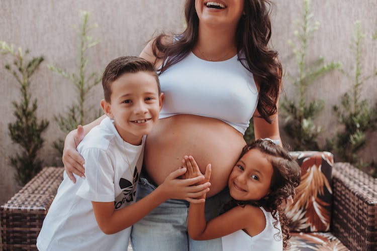 Children Posing With Pregnant Mother