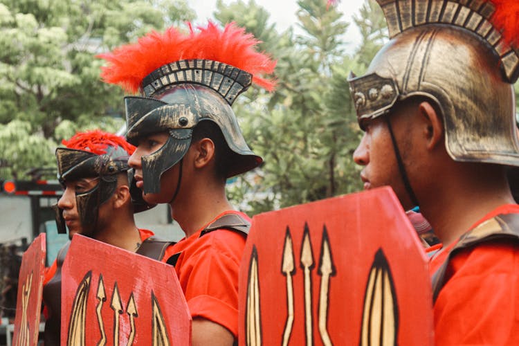 Men In Costumes On Parade Outdoors