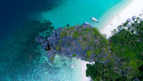 Free Stunning aerial shot of a tropical island in El Nido, showcasing pristine beaches and turquoise waters. Stock Photo