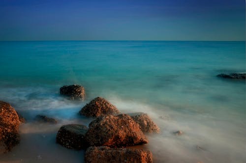 Body of Water Near Rocks