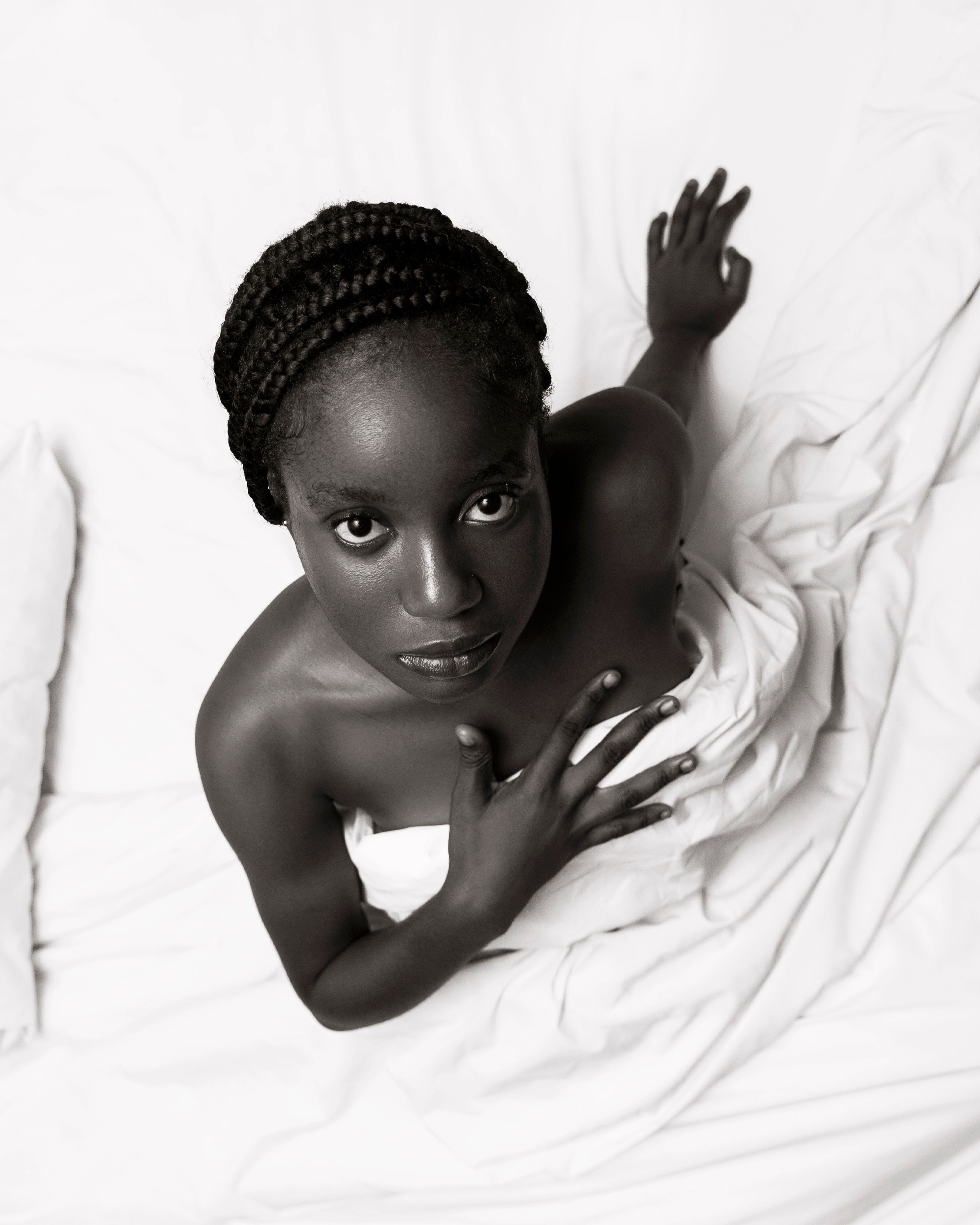 Free Black and white artistic portrait of a woman with braided hair on