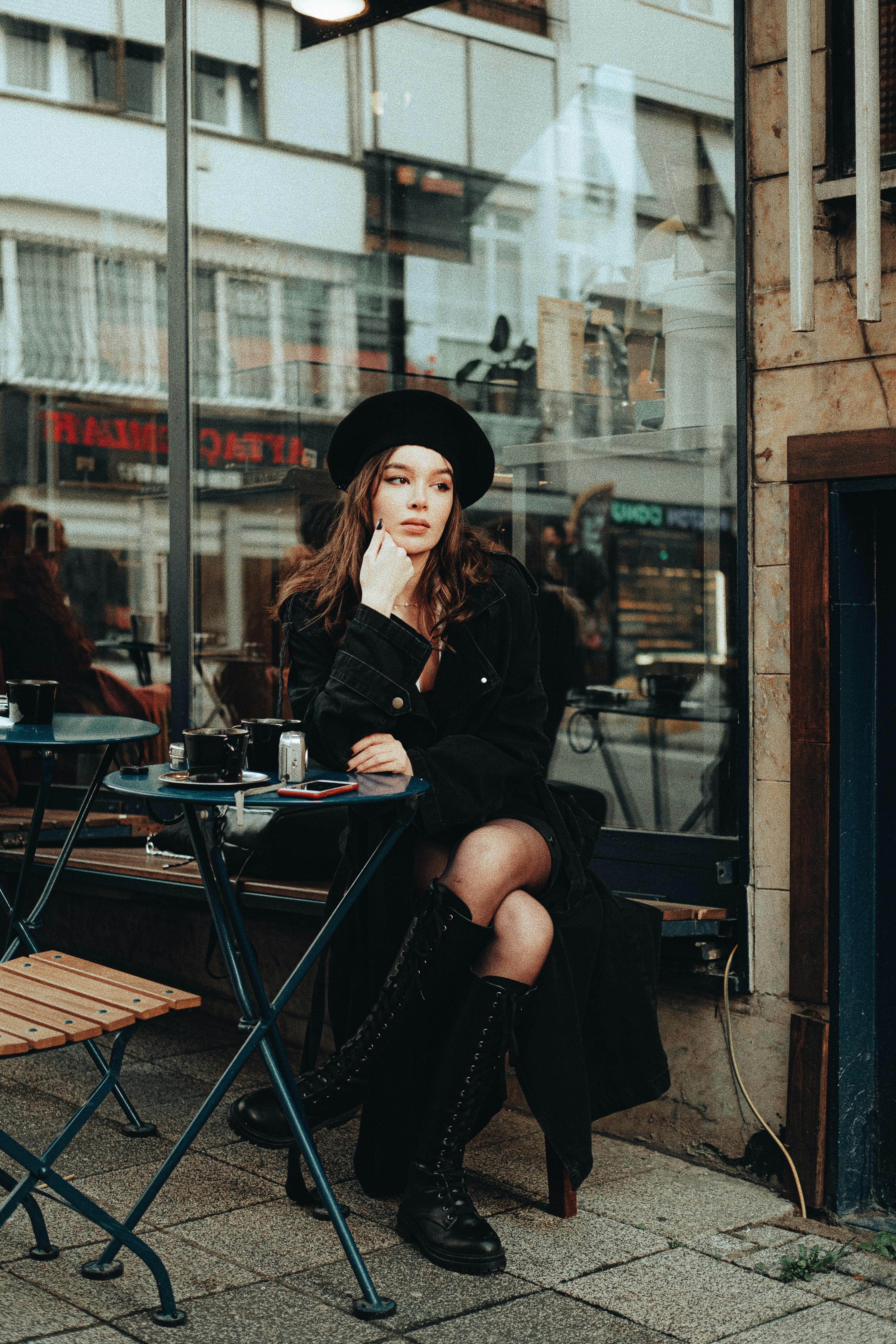 beautiful woman with beret sitting outdoor