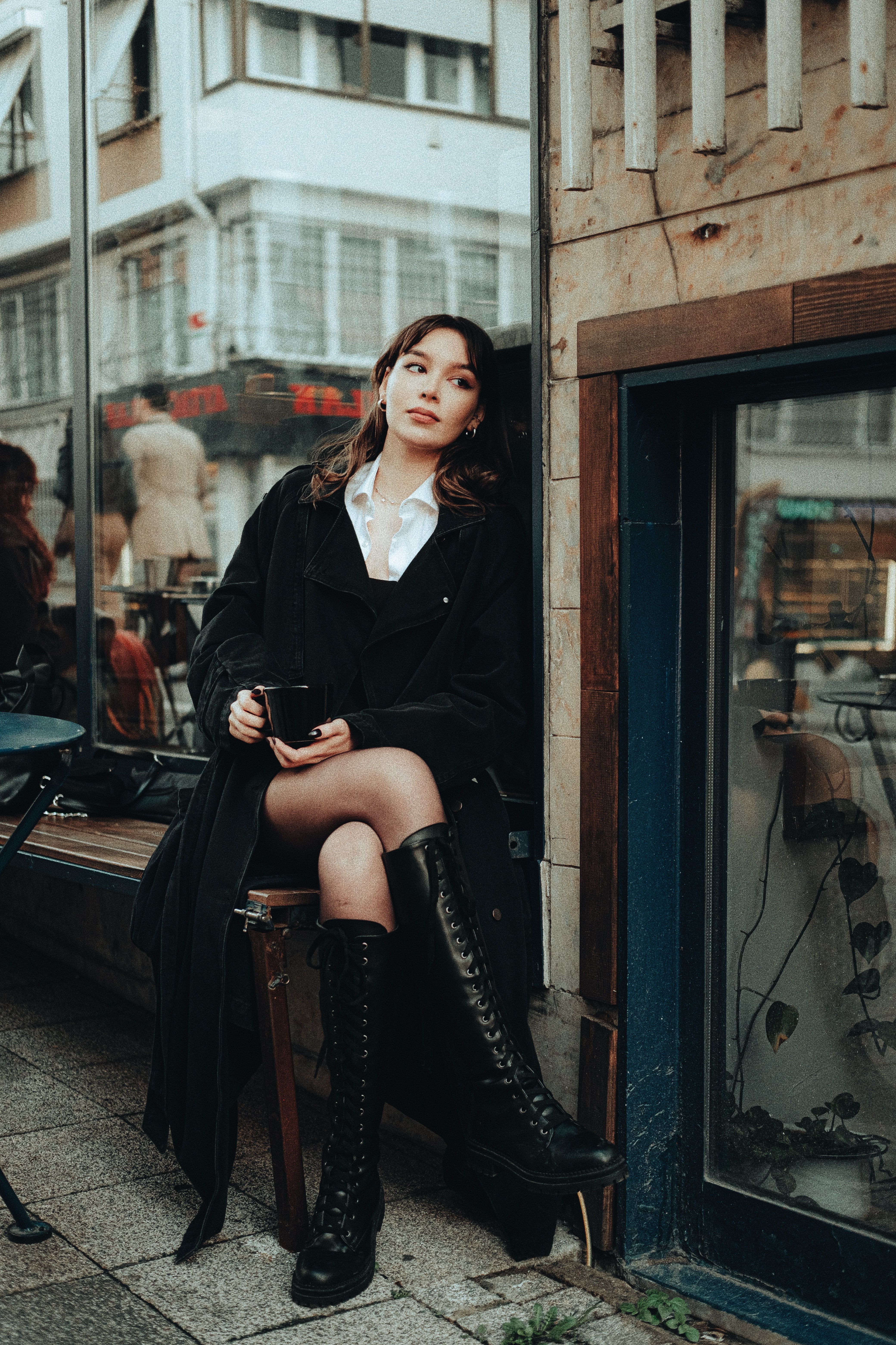 Elegant Brunette Woman in Coat Sitting on Bench · Free Stock Photo
