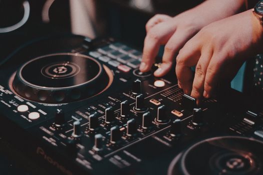Close-up of a DJ Using a Console 