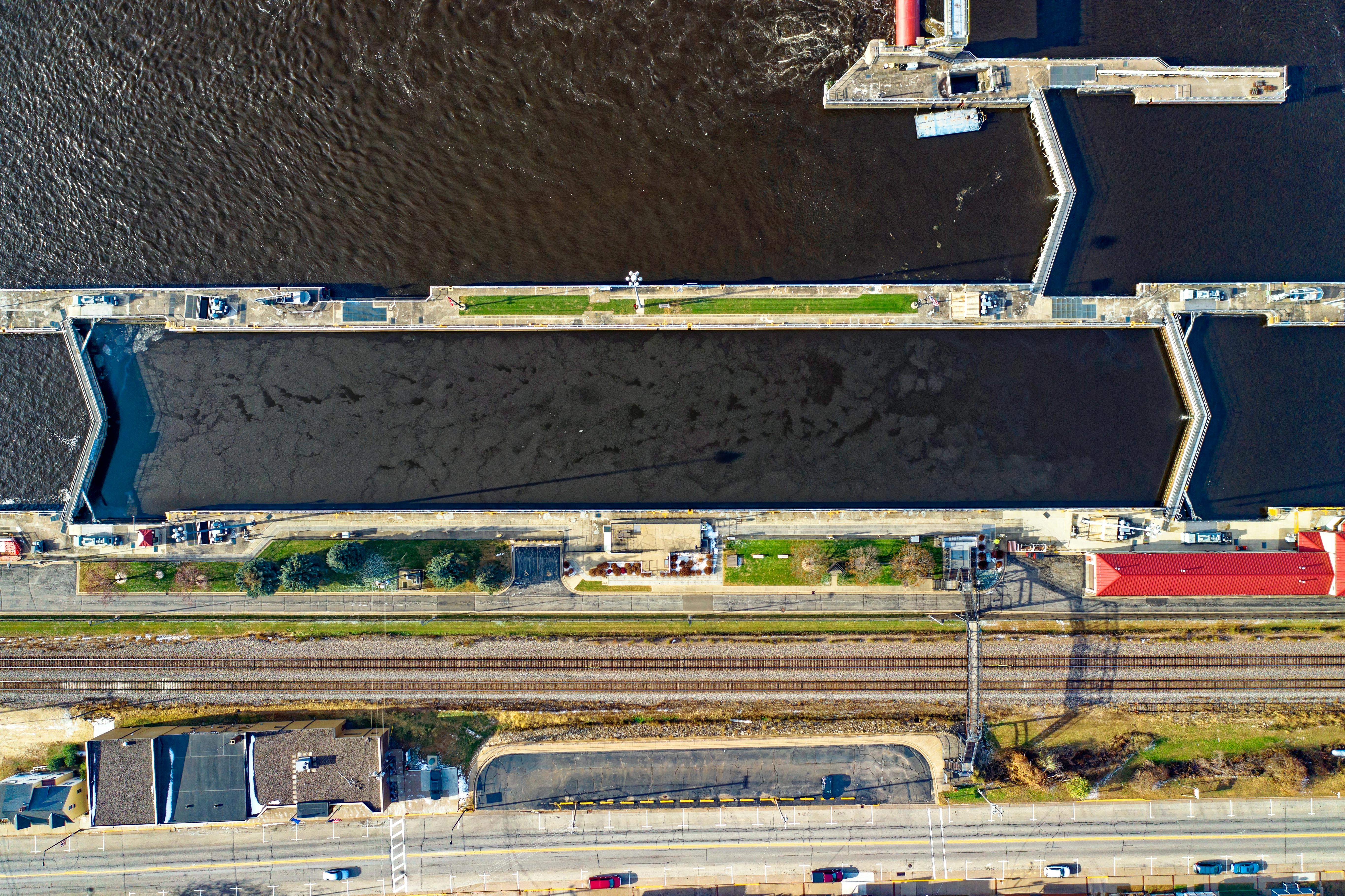 Aerial photograph showcasing a dam and railroad crossing in Alma, Wisconsin, USA.