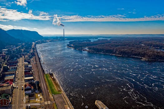 Scenic aerial view of the Mississippi River and surrounding landscape in Alma, Wisconsin, during daylight.