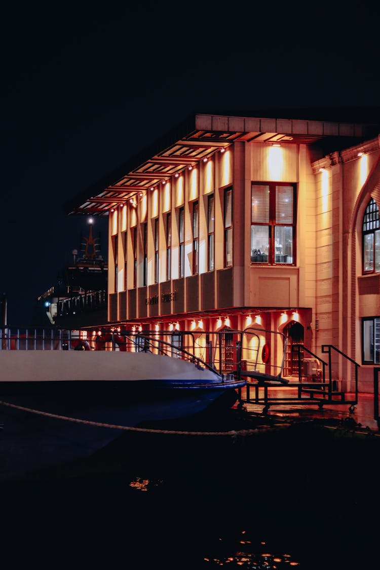 Building Near Water At Night